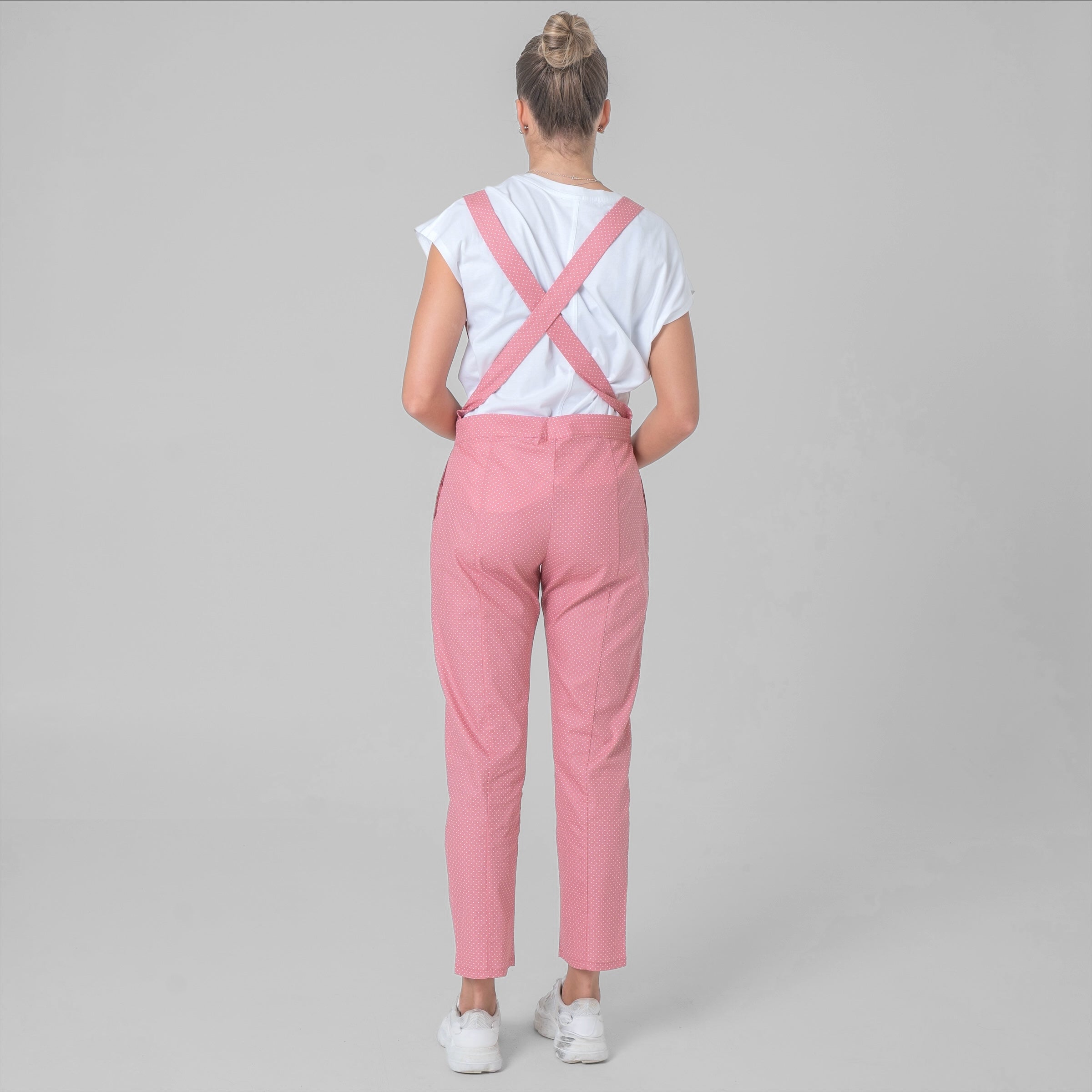 Pink cotton poplin suspender pants with white polka dots